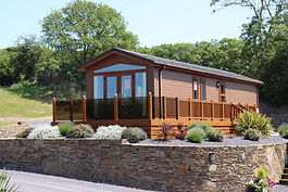 Situated on a prime, elevated plot, this stunning lodge comes complete with a glass fronted decked veranda, two bedrooms, car parking space, fully furnished and with white goods included. Carpet throughout and curtains included.
Bedroom 1
4ft 6 divan bed with headboard and mattress. TV point included.
Bedroom 2
Two 3ft divan beds with mattresses and headboards
Tv point
Bathroom
Fully fitted bathroom with shower over bath with glass screen
